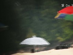 Man hiding in bushes and shooting beach girl nudists