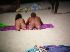 Sexy babes at the beach are playing on camera