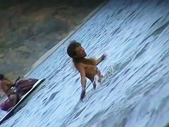 Spycam on beach records amateurs topless and also nude