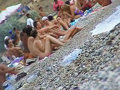 Curvy  babes filmed on a nude beach