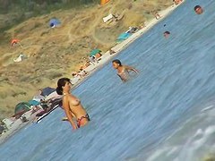 Curvy  babes filmed on a nude beach