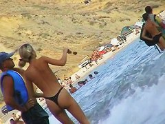 Curvy  babes filmed on a nude beach