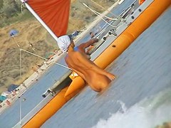 Naked amateur staying in water on beach voyeur hunter