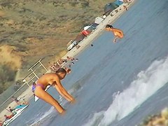 Naked amateur staying in water on beach voyeur hunter