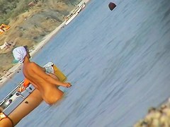 Naked amateur staying in water on beach voyeur hunter