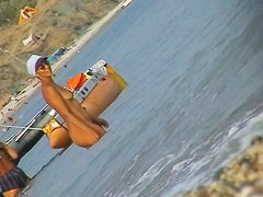 Naked amateur staying in water on beach voyeur hunter