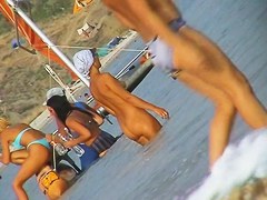 Naked amateur staying in water on beach voyeur hunter