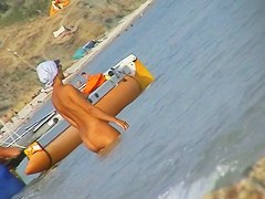 Naked amateur staying in water on beach voyeur hunter