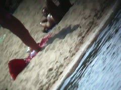 Beach voyeur vid features a hot blonde topless girl.