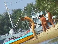 Hot beach voyeur video shows mature nudists enjoying each others company.