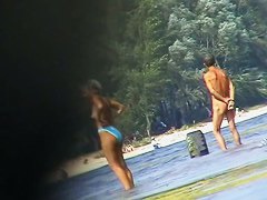 Hot beach voyeur video shows mature nudists enjoying each others company.