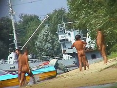Hot beach voyeur video shows mature nudists enjoying each others company.