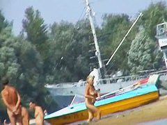 Hot beach voyeur video shows mature nudists enjoying each others company.
