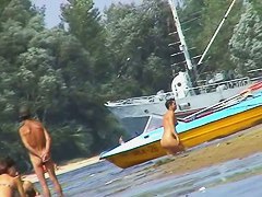 Hot beach voyeur video shows mature nudists enjoying each others company.