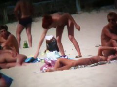 Intriguing, hot redhead in a nude beach video