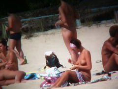 Intriguing, hot redhead in a nude beach video