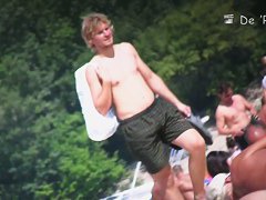 Daring lady spreads her legs at the nudist beach