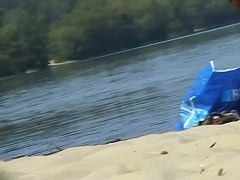 Hidden cams at the beach get two sexy naked Latina babes