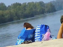 Hidden cams at the beach get two sexy naked Latina babes