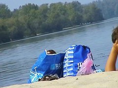 Hidden cams at the beach get two sexy naked Latina babes