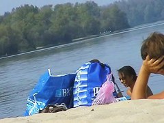 Hidden cams at the beach get two sexy naked Latina babes