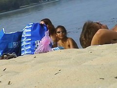 Hidden cams at the beach get two sexy naked Latina babes