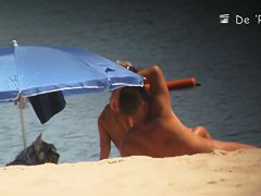 Bitches are swimming and standing on the sunny beach