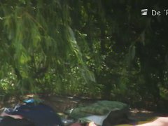 Pale and tanned saggy tits galore in this beach voyeur video