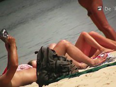 Another full of people nude beach with many babes to watch