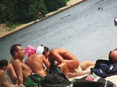 Another full of people nude beach with many babes to watch