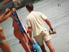 Another full of people nude beach with many babes to watch