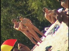 Nude spy cam on the beach with a black hair goddess in focus