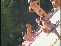 Nude spy cam on the beach with a black hair goddess in focus