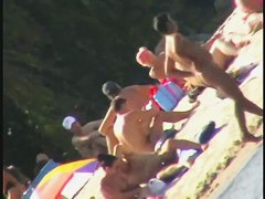 Nude spy cam on the beach with a black hair goddess in focus