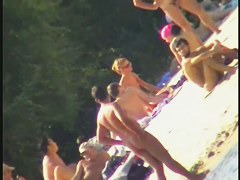 Nude spy cam on the beach with a black hair goddess in focus