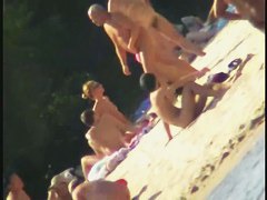 Nude spy cam on the beach with a black hair goddess in focus