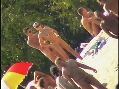 Nude spy cam on the beach with a black hair goddess in focus
