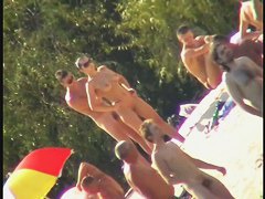 Nude spy cam on the beach with a black hair goddess in focus