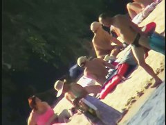 Nude spy cam on the beach with a black hair goddess in focus