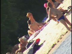 Nude spy cam on the beach with a black hair goddess in focus