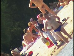 Nude spy cam on the beach with a black hair goddess in focus