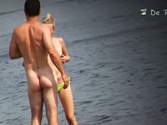 Naked hotties followed around by a nude beach voyeur