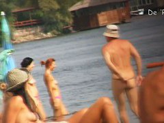 Naked hotties followed around by a nude beach voyeur