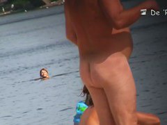 Naked hotties followed around by a nude beach voyeur