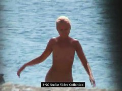 Hot blonde shows her naked hairy pussy on the beach