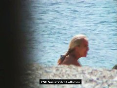 Hot blonde shows her naked hairy pussy on the beach