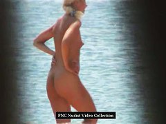 Hot blonde shows her naked hairy pussy on the beach