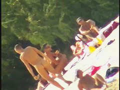 Blonde naked babe with shaved pussy on public beach nudist exposure