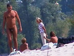 Perky breasted nude beach MILF filmed by a voyeur