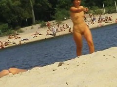 Voyeur preys on a juicy ass on the nudist beach